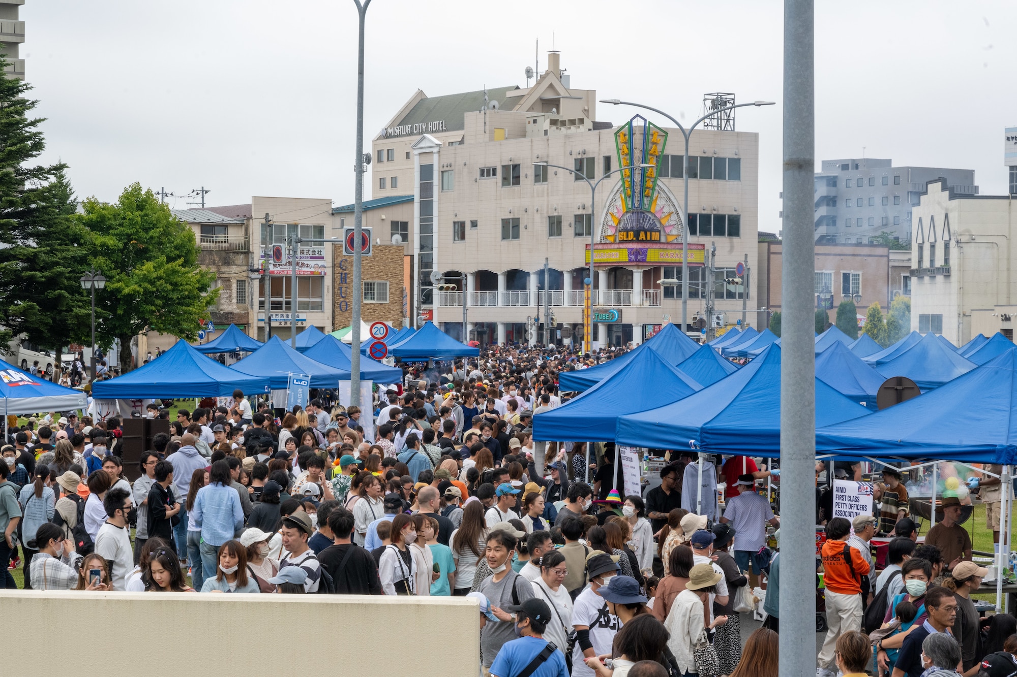 Japanese and Americans line the street, shoulder-to-shoulder, during American Day showcasing the strength of the U.S.-Japan Alliance in Misawa City, Japan, June 25, 2023. More than 50,000 attendees from across Japan traveled to Misawa City to enjoy and appreciate American and Japanese culture. (U.S. Air Force photo by Staff Sgt. Kristen Heller)