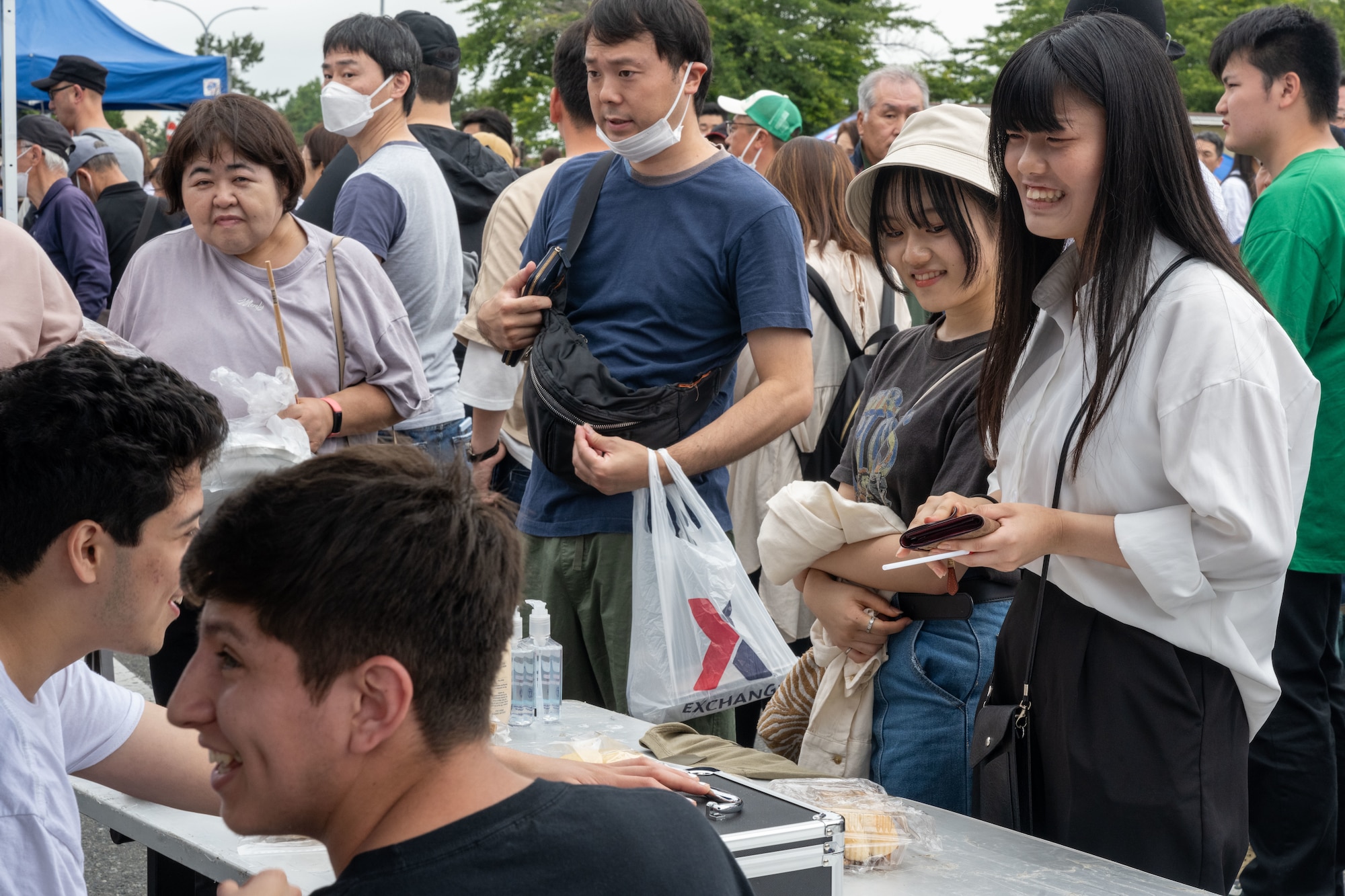 Japanese attendees of American Day purchase American style food in Misawa City, Japan, June 25, 2023. More than 50,000 attendees from across Japan traveled to Misawa City to enjoy and appreciate American and Japanese culture. (U.S. Air Force photo by Staff Sgt. Kristen Heller)