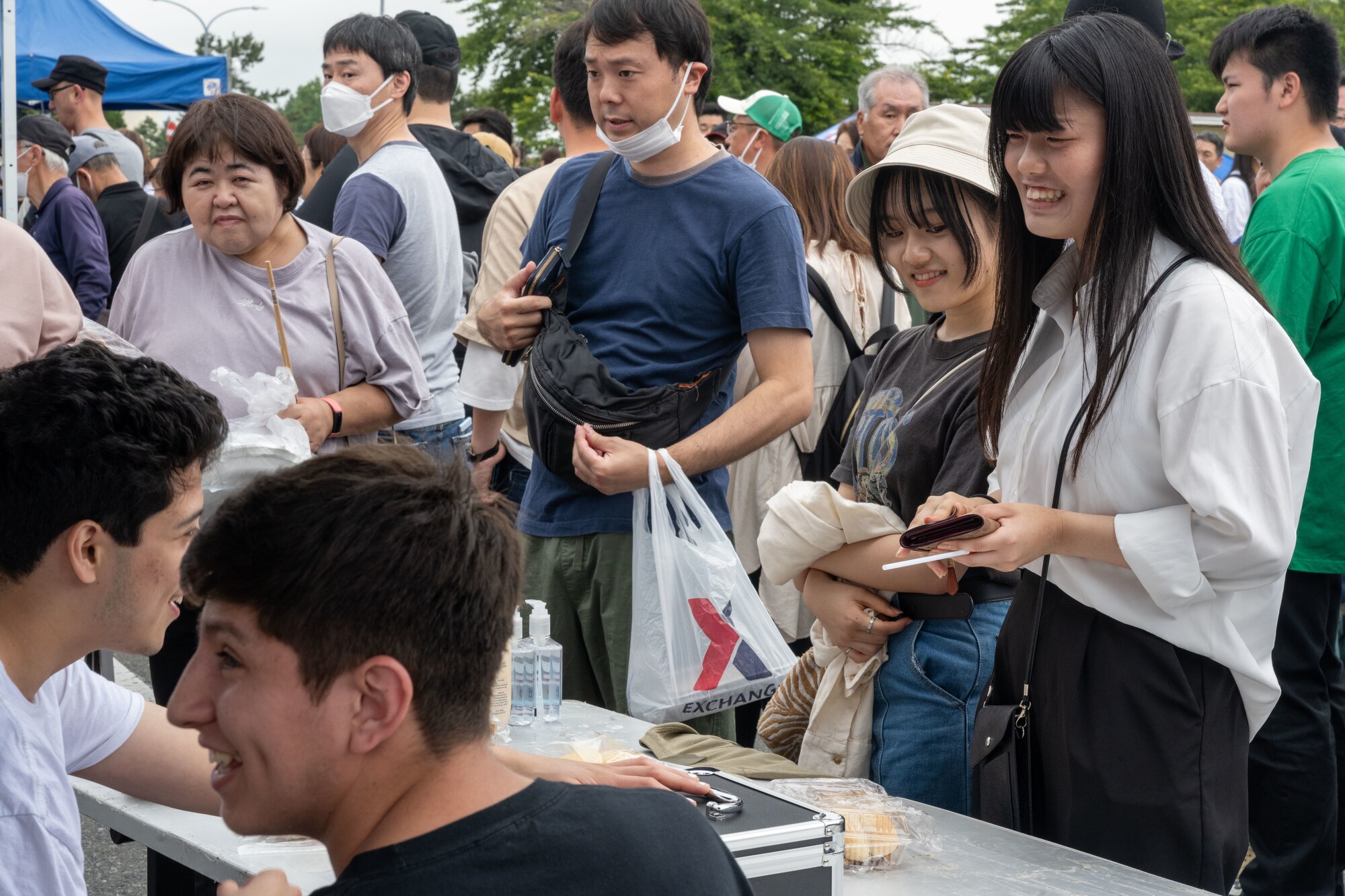 Japanese attendees of American Day purchase American style food in Misawa City, Japan, June 25, 2023. More than 50,000 attendees from across Japan traveled to Misawa City to enjoy and appreciate American and Japanese culture. (U.S. Air Force photo by Staff Sgt. Kristen Heller)