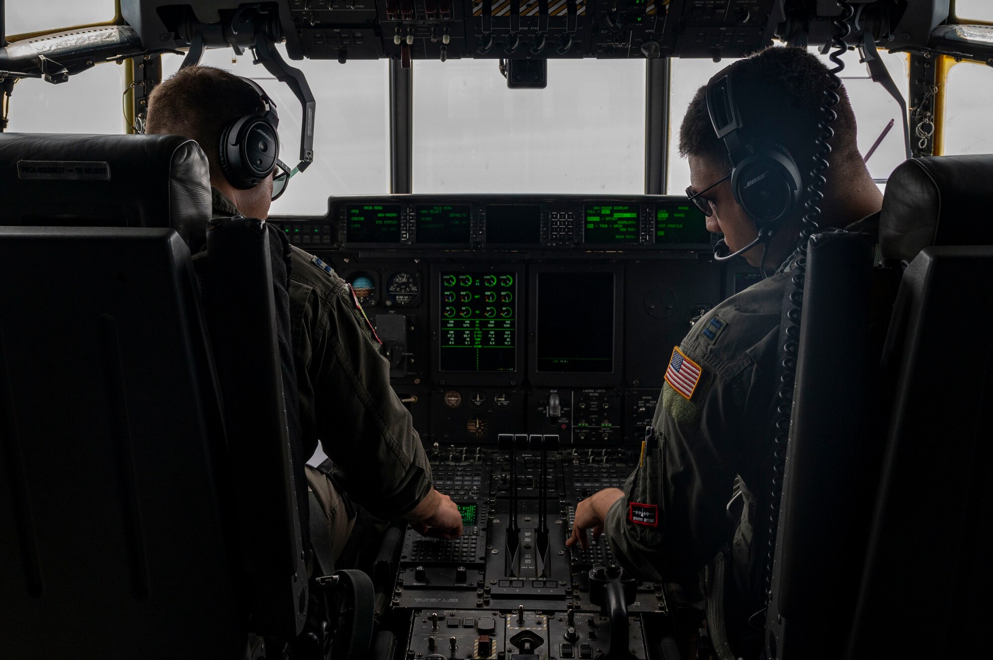 Two C-130J Super Hercules from the 19th Airlift Wing fly alongside a KC-135R from Key Field Air National Guard Bas, Mississippi, over Arkansas