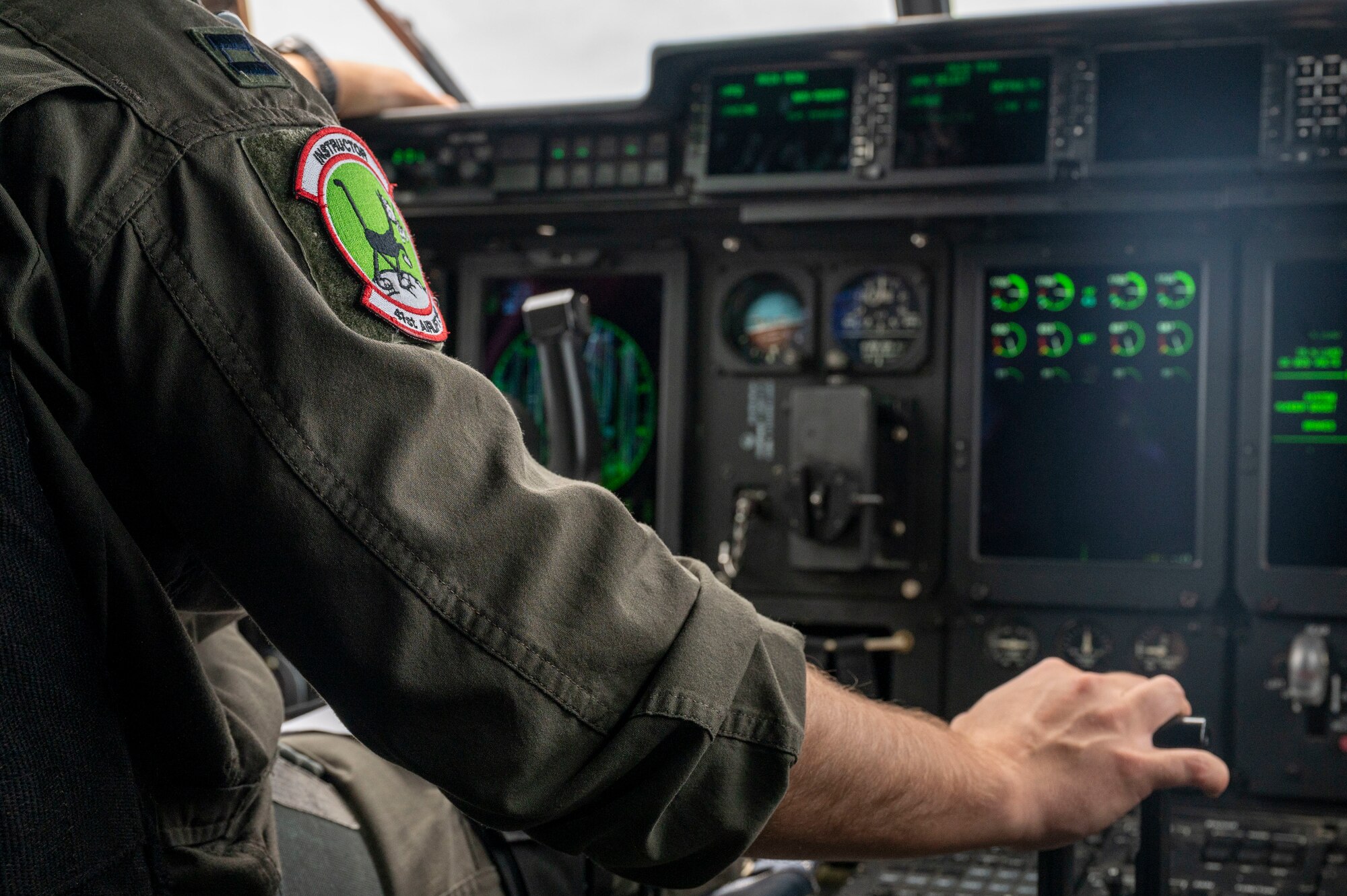 Two C-130J Super Hercules from the 19th Airlift Wing fly alongside a KC-135R from Key Field Air National Guard Bas, Mississippi, over Arkansas