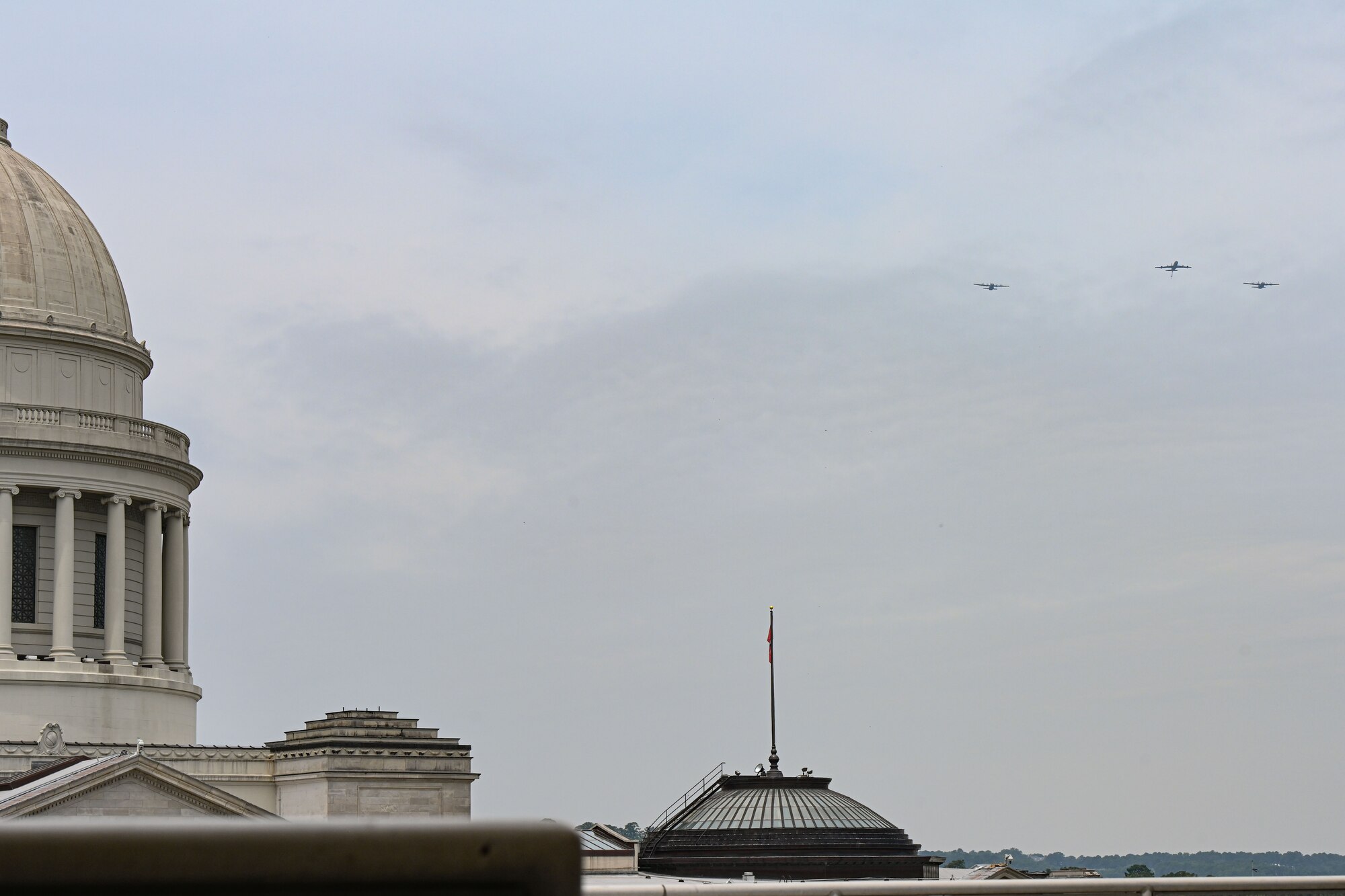 Two C-130J Super Hercules from the 19th Airlift Wing fly alongside a KC-135R from Key Field Air National Guard Bas, Mississippi, over Arkansas