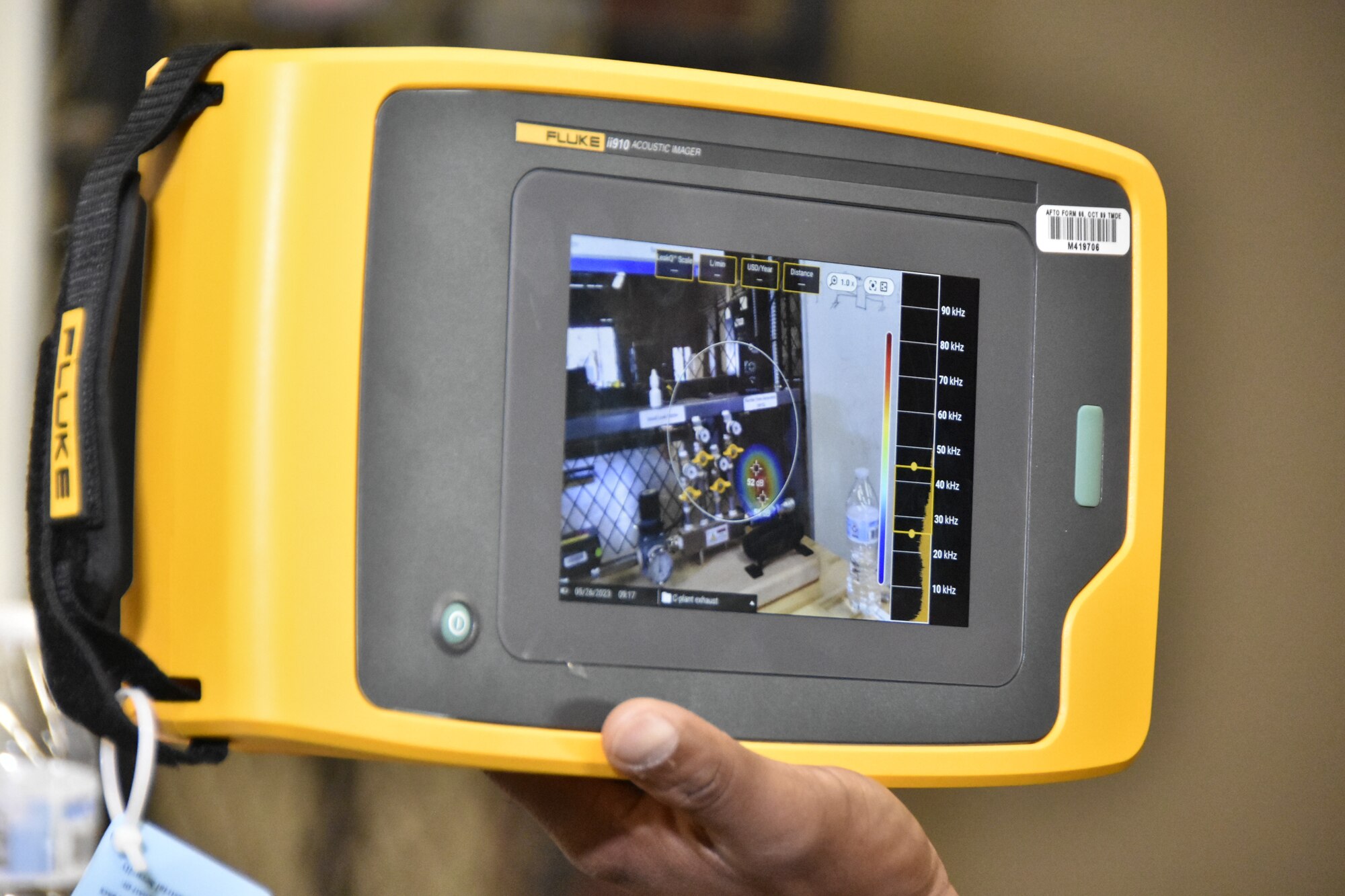 Wayne Horton, ultrasound lead at Arnold Air Force Base, Tenn., uses the leak simulator in the Innovation Center May 26, 2023, to demonstrate the recently-acquired acoustic imager that can identify leaks in compressed air, gas and vacuum systems. The imager allows users to see the exact location of a leak on a digital image displayed on the device. It can also determine the distance, size and decibel level of a leak. The imager was one of seven projects that received funding through the 2023 AEDC Spark Tank program, which allows members of the AEDC workforce to propose suggestions for improving AEDC processes, products and test capabilities. (U.S. Air Force photo by Bradley Hicks)