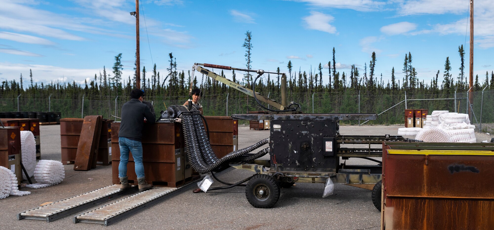 Members of the 51st Munitions Squadron from Osan Air Base, Republic of Korea, operate a 30mm munitions loader during Red Flag Alaska 23-2 at Eielson Air Force Base, Alaska, June 12, 2023.