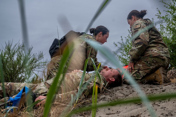 507th Medical Squadron Airmen evaluate a simulated patient for injuries during EXERCISE AGILE BLIZZARD-UNIFIED VISION 2023
