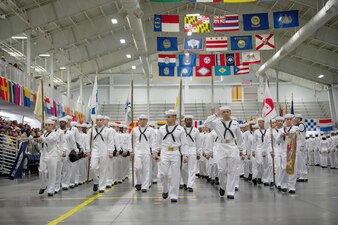 Graduating Sailors march in formation during a pass-in-review graduation ceremony at Recruit Training Command.