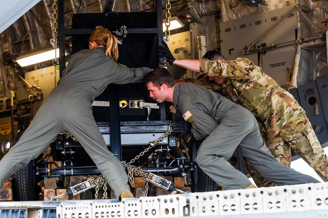 Airmen reposition cargo.