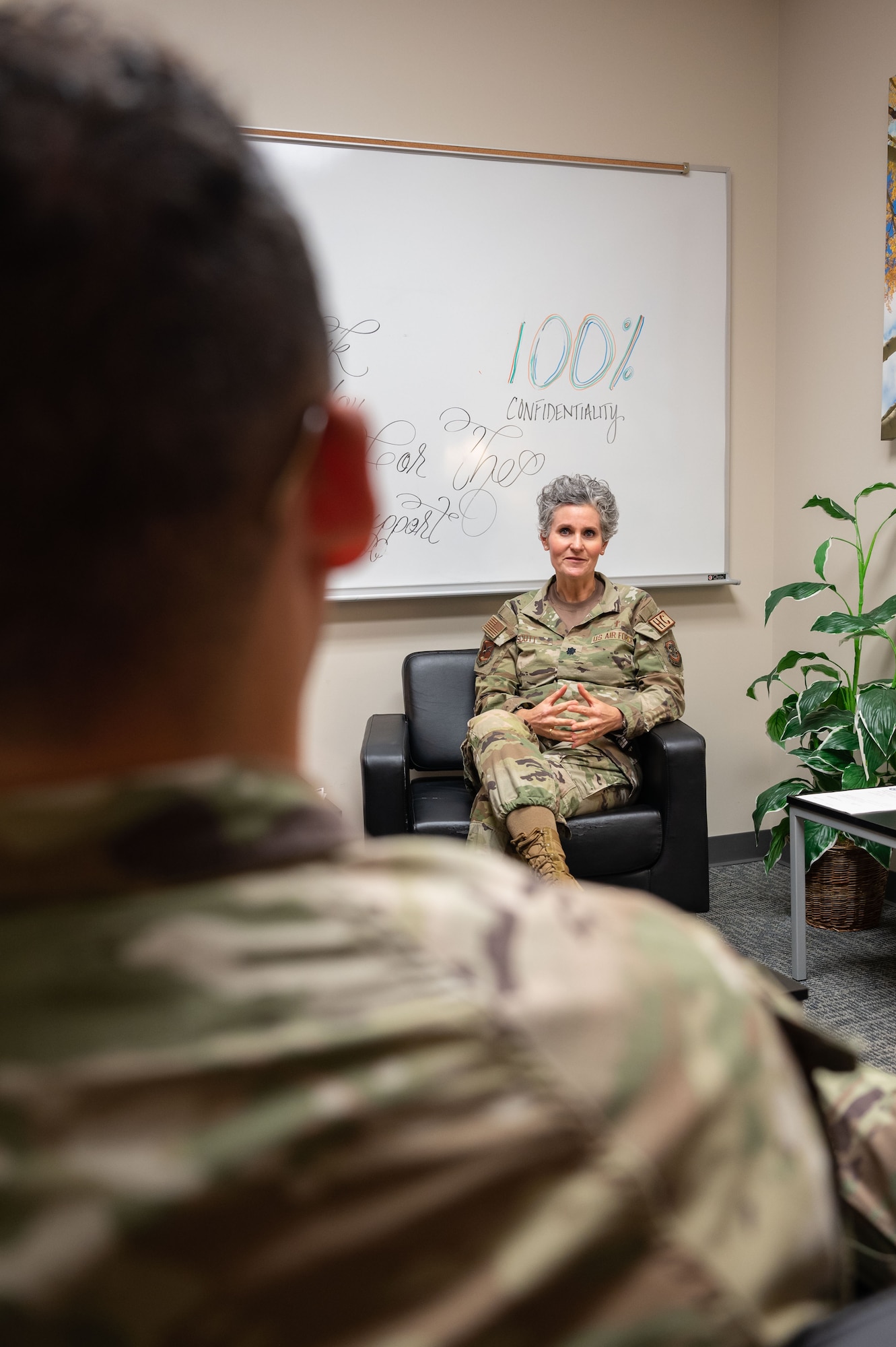 Lt. Col. Katherine Scott, 436th Airlift Wing chaplain, speaks with Senior Airman Benito Reina, 436th Airlift Wing religious affairs Airmen, at Dover Air Force Base, Delaware, June 27, 2023. The chapel is just one of the many helping agencies on Dover AFB and is featured on the Wellness Wheel, an interactive resource that allows users to assess all aspects of their personal wellness. The Wellness Wheel can be accessed at https://www.doverfss.com/dafb-wellness-wheel. (U.S. Air Force photo by Senior Airman Cydney Lee)