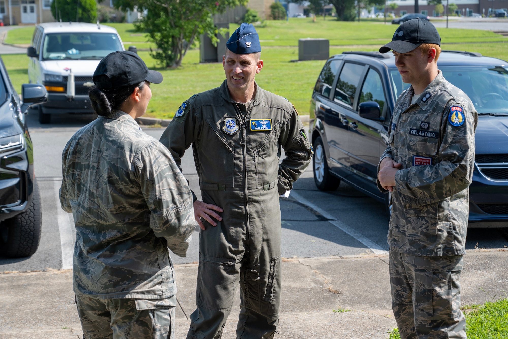A man speaks to two Civil Air Patrol cadets