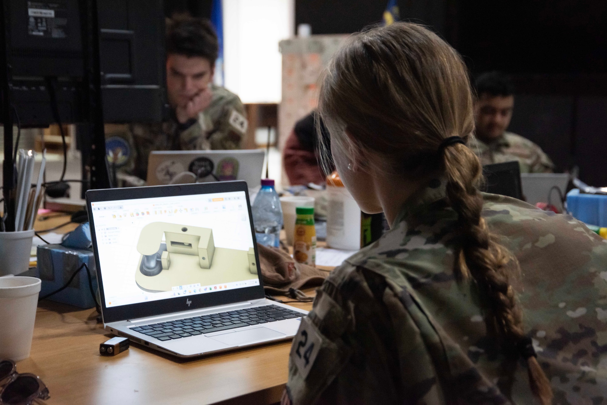 U.S. Air Force Academy cadet Leah Watson, a mechanical engineering major, creates a 3-D model at Task Force 99, Al Udeid Air Base, Qatar, June 22, 2023. The cadets participated in research and innovation at TF 99 as part of the academy’s Cadet Summer Research Program (CSRP). TF 99 is the cornerstone of Ninth Air Force (AFCENT)’s approach to U.S. Central Command’s intent of building a Culture of Innovation by using commercial and government off-the-shelf technology and partnering with Academia, Industry, and coalition members in order to solve operational problem sets. (U.S. Air Force photo by Staff Sgt. Jennifer Zima)