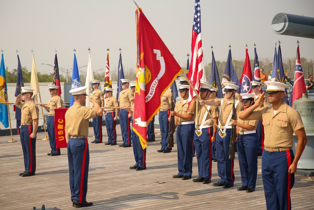 U.S. Marines with 2nd Network Battalion salute while the National Anthem plays during a change of command ceremony aboard the USS North Carolina in Wilmington, North Carolina, June 9, 2023. The change of command ceremony is a time-honored tradition which formally signifies the transfer of command and entails the total accountability, authority and responsibility from one individual to another.