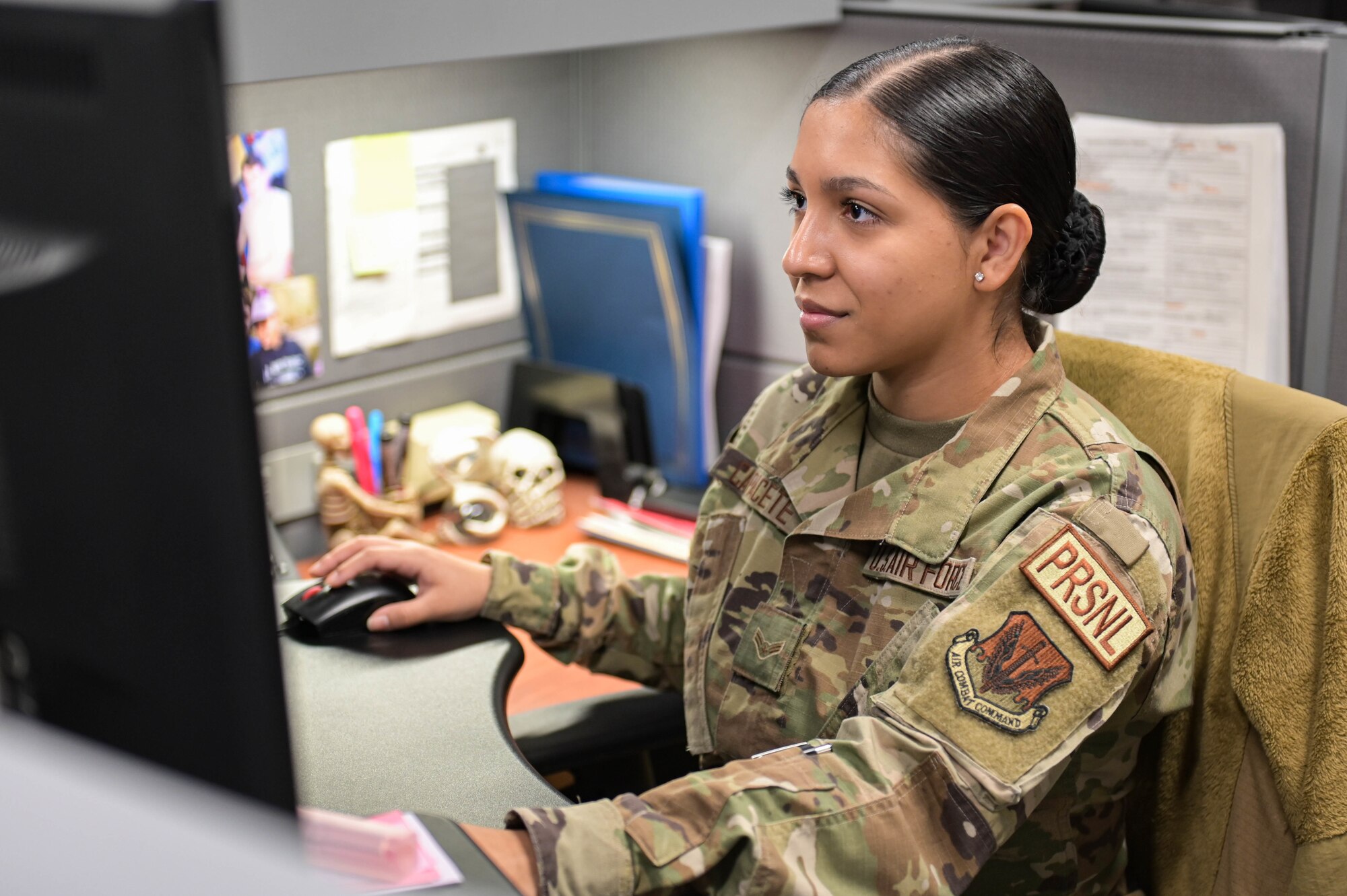 U.S. Air Force Airman 1st Class Vivian Capacete, 23rd Force Support Squadron career development technician, reads through electronic forms at Moody Air Force Base, Georgia, April 5, 2022. The career development flight helps manage Airmen’s careers so they can focus more on the job. (U.S. Air Force photo by Senior Airman Rebeckah Medeiros)