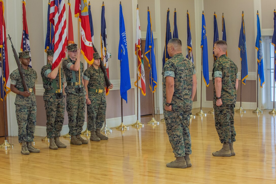 U.S. Marine Corps Col. Ryan M. Hoyle (right), outgoing commanding officer, 24th Marine Expeditionary Unit, and Col. Todd E. Mahar (left), oncoming commanding officer, take their place in the reviewing area during the 24th MEU Change of Command at Camp Lejeune, N.C., June 26, 2023. The change of command ceremony represents the official passing of authority from the outgoing commander to the incoming commander. (U.S. Marine Corps photo by Gunnery Sgt. Hector de Jesus)