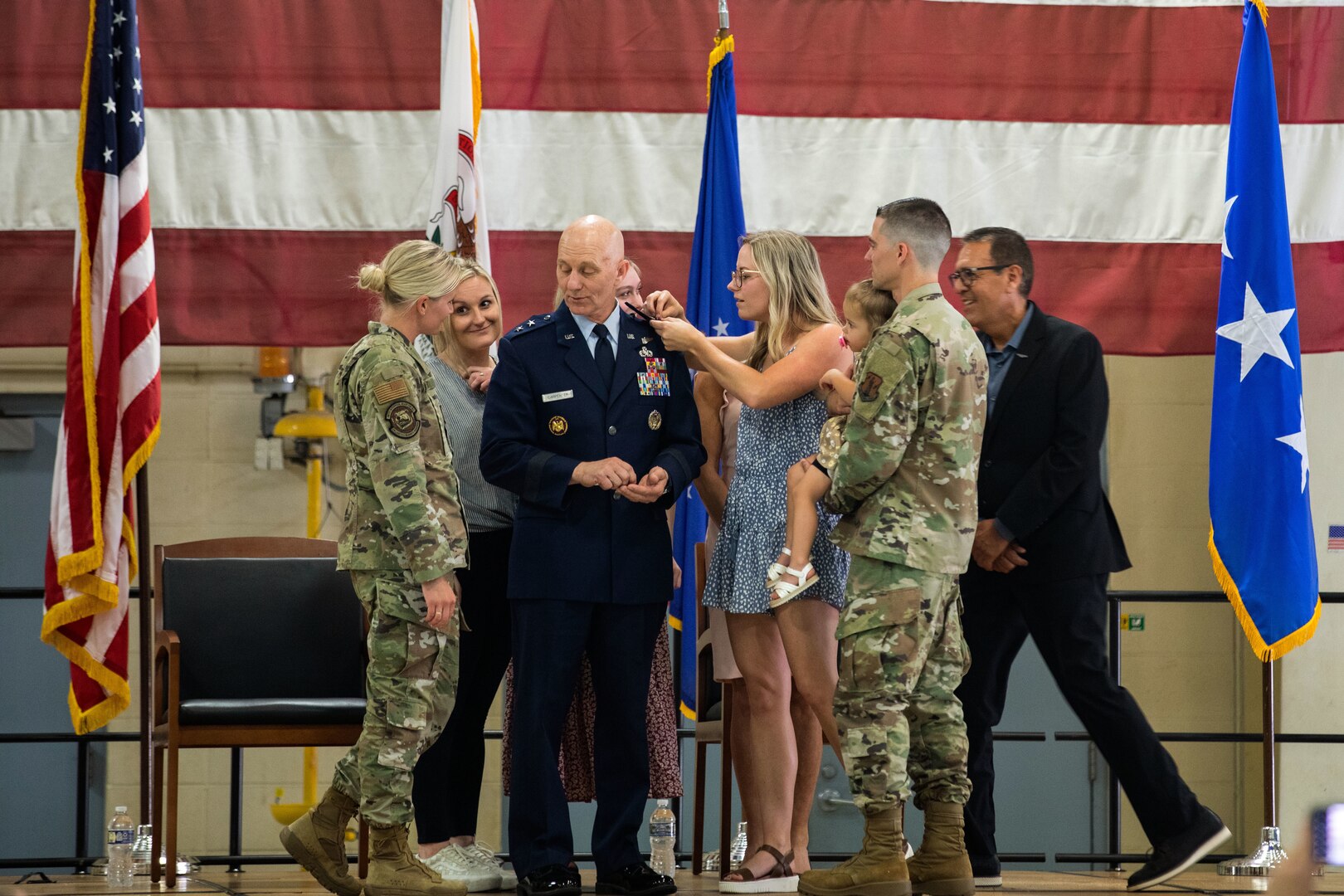 Donald “DK” Carpenter, is pinned to major general by his family June 1, 2023, at the Illinois National Guard’s 182nd Airlift Wing in Peoria, Illinois.