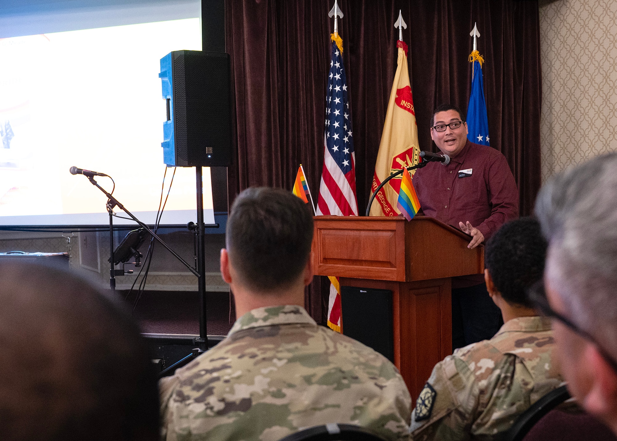 Angel Perez, Caroline Pride chief executive officer and executive director, speaks to attendees during a  Pride Month symposium, June 28, 2023, at Fort George G. Meade, Maryland. Fort Meade Garrison and 70th Intelligence Surveillance, Reconnaissance Wing Diversity & Inclusion council hosted the event to celebrate, recognize and educate communities to uphold equality, dignity, and respect for all. (U.S. Air Force photo by Staff Sgt. Kevin Iinuma)