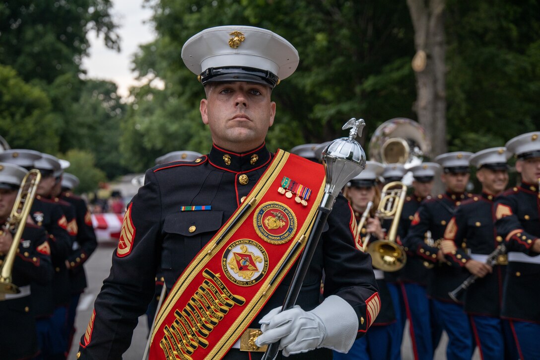 U.S. Marine Corps Staff Sgt. Kevin Dalton, drum major with the 2nd Marine Aircraft Wing (MAW) Band, marches in a parade during the 47th Annual Sturgis Falls Celebration at Cedar Falls, Iowa, June 24, 2023. U.S. Marines with the 2nd MAW Band performed concerts to strengthen community relationships and reaffirm the history, customs, and traditions representative of the United States Marine Corps to those in attendance. This year marked over two decades that a Marine Corps band has supported the Annual Sturgis Falls Celebration. (U.S. Marine Corps photo by Staff Sgt. Theodore Bergan)