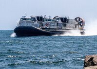 The next-generation landing craft, Ship to Shore Connector (SSC), Landing Craft, Air Cushion (LCAC) 107, flies to Naval Surface Warfare Center Panama City Division, June 28. The delivery of LCAC 107 comes after completion of Acceptance Trials conducted by the Navy’s Board of Inspection and Survey, which tested the readiness and capability of the craft to effectively meet its requirements. (U.S. Navy photo by Eddie Green)
