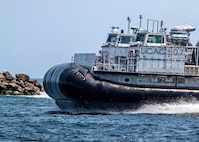 The next-generation landing craft, Ship to Shore Connector (SSC), Landing Craft, Air Cushion (LCAC) 107, flies to Naval Surface Warfare Center Panama City Division, June 28. The delivery of LCAC 107 comes after completion of Acceptance Trials conducted by the Navy’s Board of Inspection and Survey, which tested the readiness and capability of the craft to effectively meet its requirements. Textron Systems is currently in serial production on LCACs 108-119. (U.S. Navy photo by Eddie Green)
