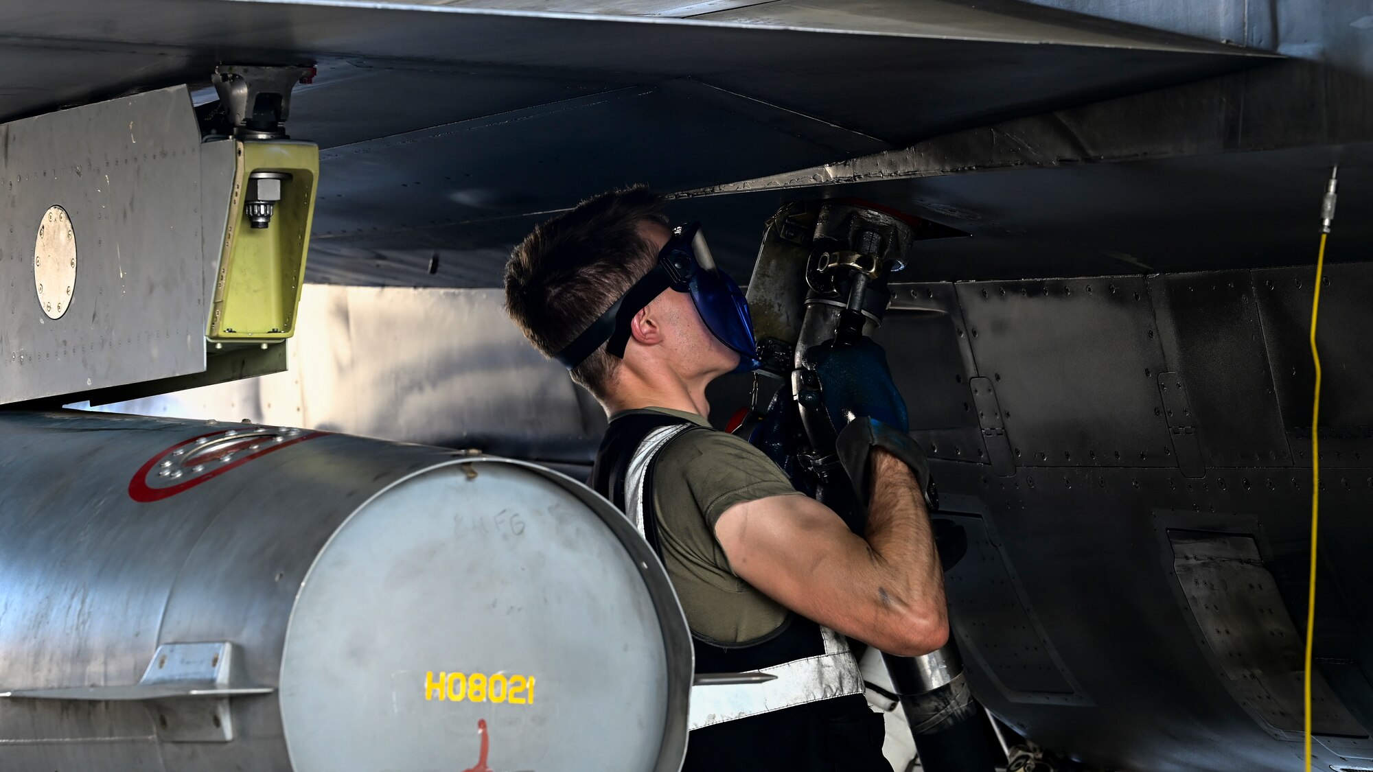U.S. Air Force Senior Airman Mason Schumacher, 849th Aircraft Maintenance Squadron assistant dedicated crew chief, refuels an F-16 Viper at Holloman Air Force Base, New Mexico, June 27, 2023.
