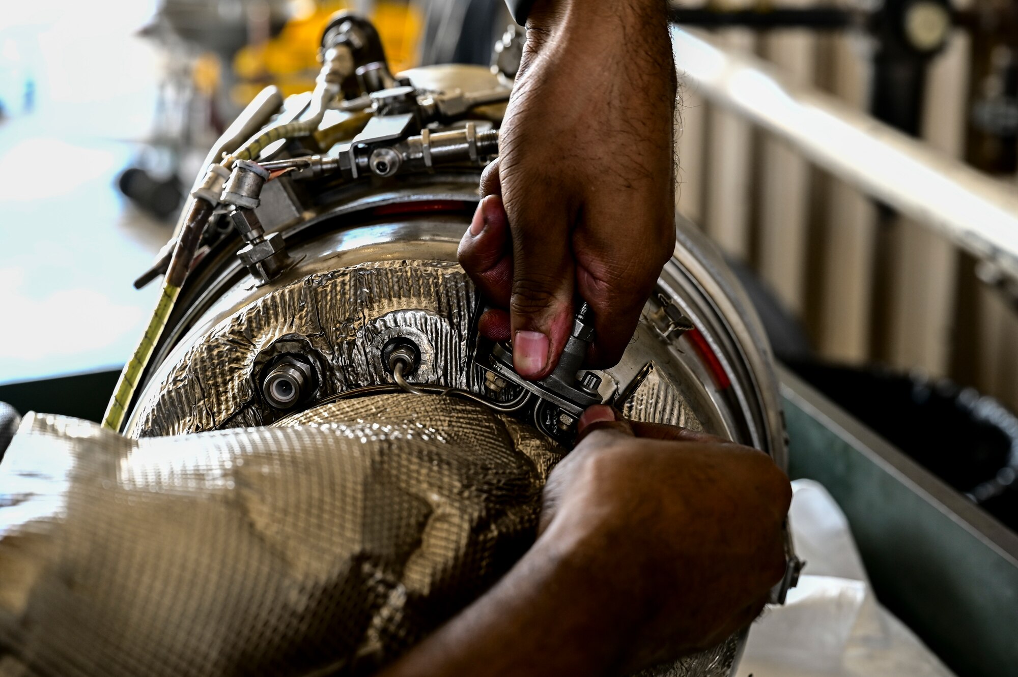 An Airman from the 849th Aircraft Maintenance Squadron performs maintenance on an F-16 Viper part at Holloman Air Force Base, New Mexico, June 27, 2023.