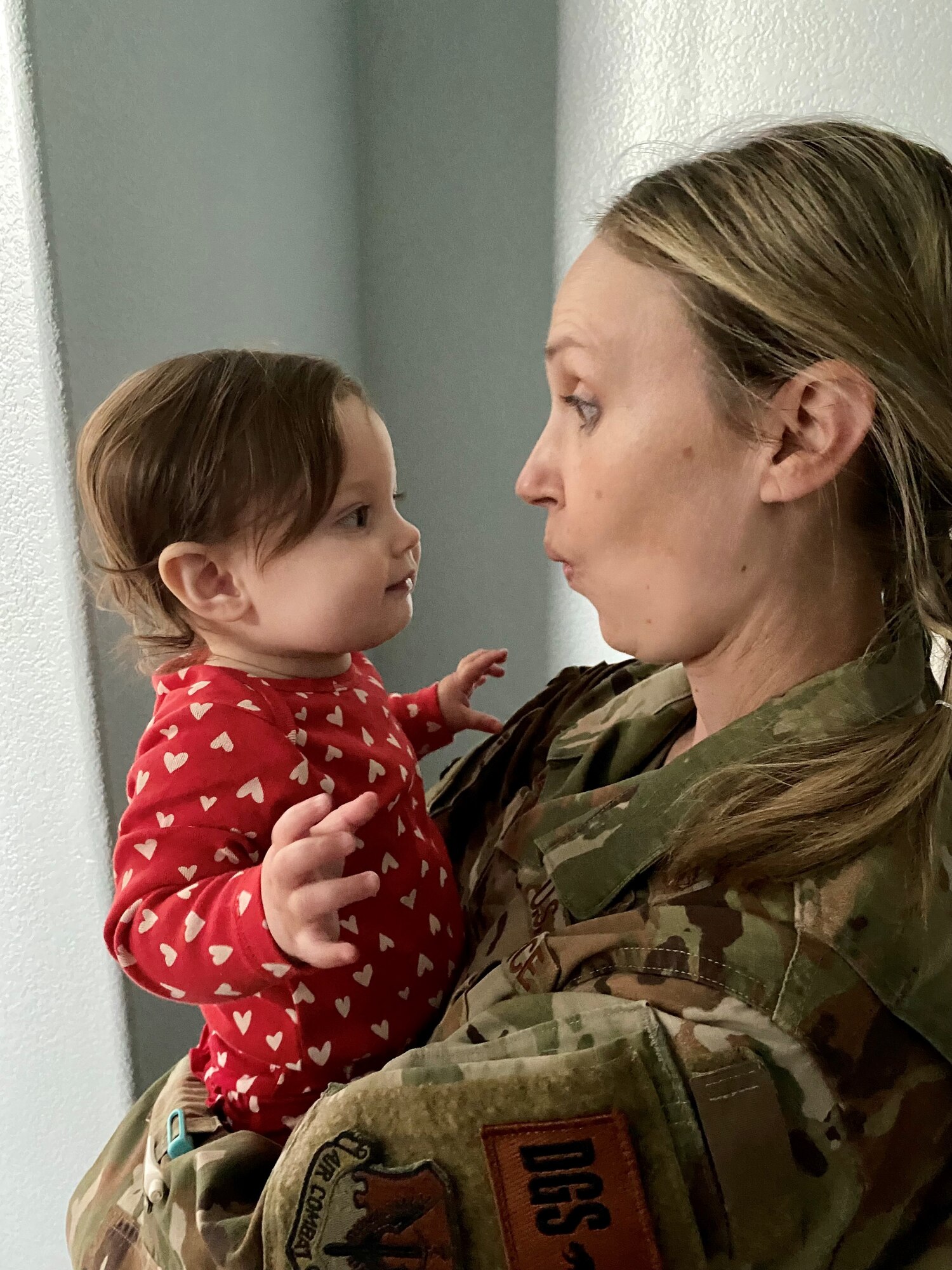 U.S. Air Force Lt. Col. Sarah Avila, M.D., holds her daughter, Feb. 16, 2022 in Roseville, California.
