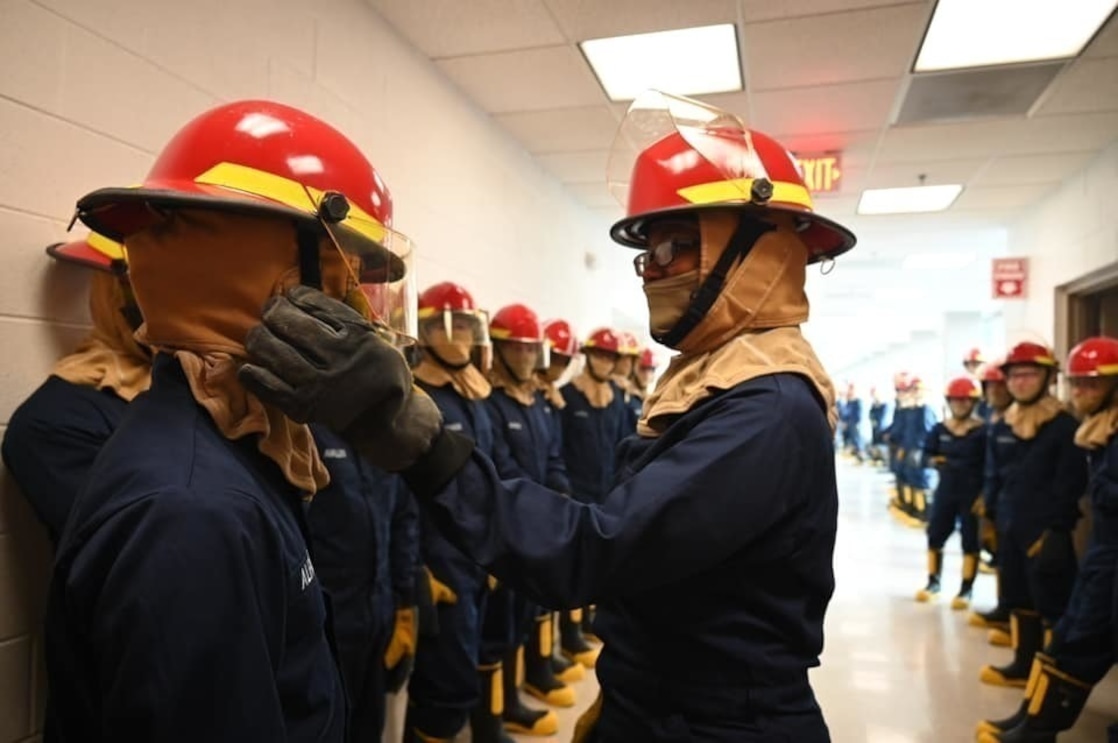 Sailors in various engineering ratings get ready for the shipboard firefighting trainer at Surface Warfare Engineering School Command Great Lakes.