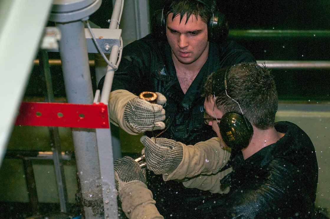 Sailors receive hands-on training inside the Damage Control Wet Trainer at Trident Training Facility at Naval Base Kitsap-Bangor.  The trainer is designed to help submariners prepare for deployments by simulating flooding in a controlled environment.