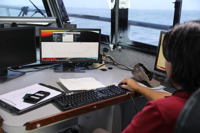 Jasper Schaer, U.S. Army Corps of Engineers Galveston District, Hydro Survey Team, prepares a shipping channel map prior to beginning a post dredge survey. Single beam sonar sound waves are measured and recorded aboard the survey vessel, Tanner II. Single beam sonar was used for this survey because this version uses lower frequency sound than multi-beam sonar. The lower frequency gives better measurements through the fluff or fine sediment at the bottom of the Houston Shipping Channel.