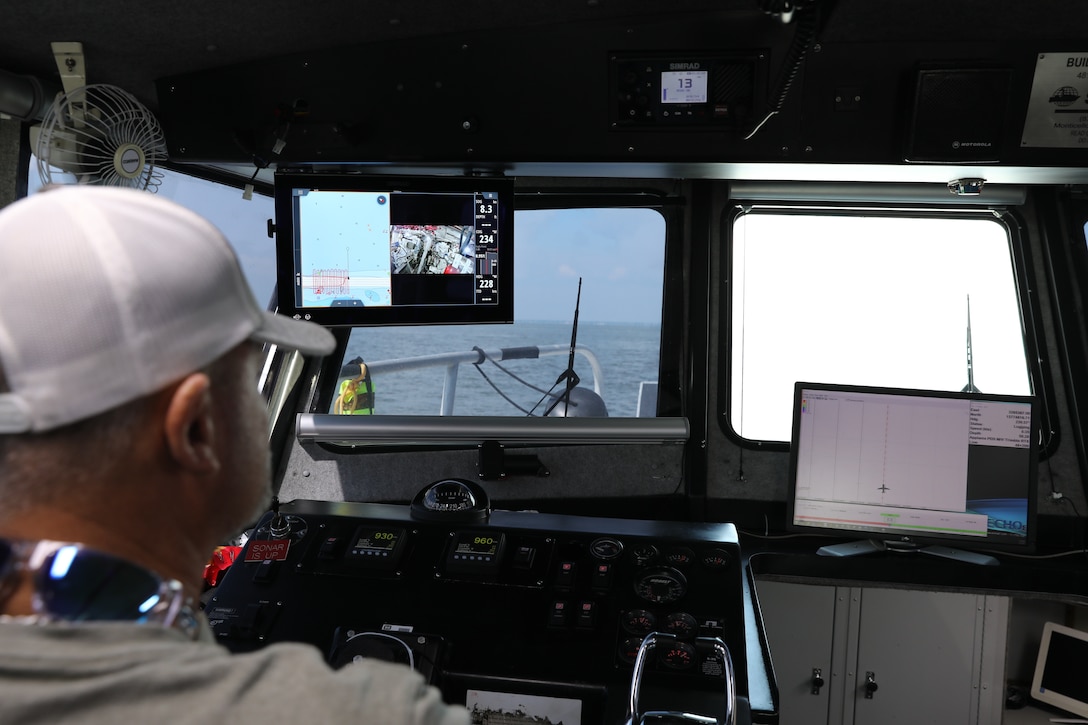 James Hiroms, Galveston District boat captain, watches the computer monitor which shows him the line to drive for an accurate survey. The single beam sonar sends data to shipboard computers to complete the post dredging map.