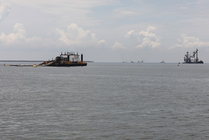 Weeks 189, a dredge pipeline pumping unit, center, works to pump dredge material from the Houston Shipping Channel. On the right is DB Avalon, one of North America’s largest clamshell dredges.