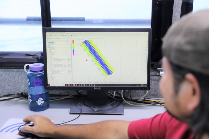 Jasper Schaer, U.S. Army Corps of Engineers Galveston District, Hydro Survey Team, observes a Houston Shipping Channel map after completing a post dredge survey aboard the Tanner II survey vessel. Single beam sonar was used for this survey because this version uses lower frequency sound than multi-beam sonar. The lower frequency gives better measurements through the fluff or fine sediment at the bottom of the Houston Shipping Channel.