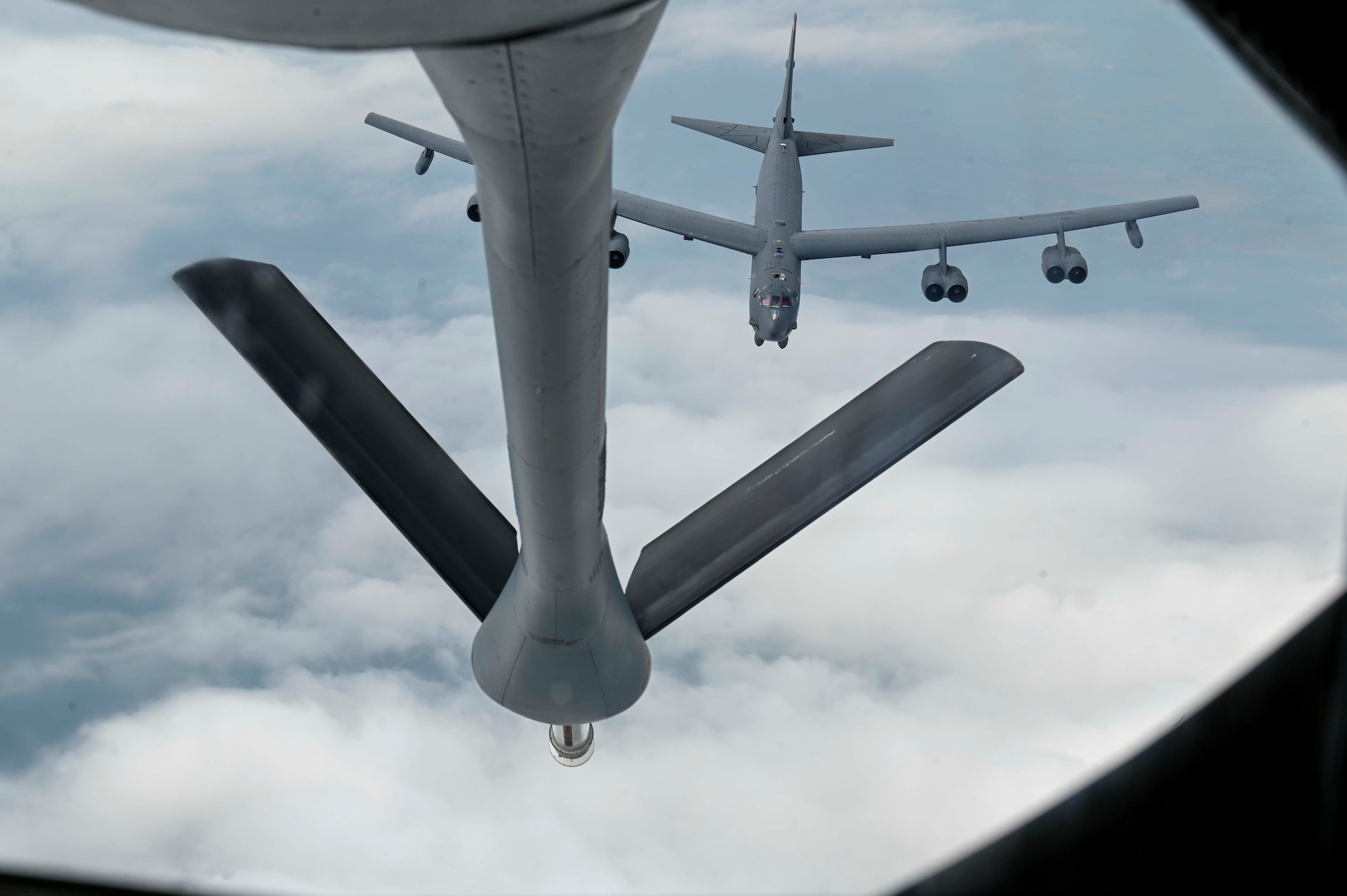 A KC-135 Stratotanker assigned to the 92nd Air Refueling Wing demonstrates aerial refueling capabilities with a Boeing B-52 Stratofortress from Minot Air Force Base, Montana, as part of Operation Centennial Contact out of Fairchild Air Force Base, Washington, June 27, 2023. The movement, which included flights over Yellowstone National Park, Mount Rushmore, and Glacier National Park, was part of Air Mobility Command’s celebration of 100 years air refueling operations and demonstrated the 92nd Air Refueling Wing’s global reach capabilities. Since its inception in 1923, air refueling has become a crucial component of military and civilian aviation operations around the world by extending the range and endurance of aircraft and enabling them to complete missions that would otherwise be impossible or require multiple stops. As a result, this capability is essential for strategic and tactical operations, as well as humanitarian relief efforts in support of AMC, U.S. Transportation Command and Department of Defense priorities. (U.S. Air Force photo by Airman 1st Class Haiden Morris)