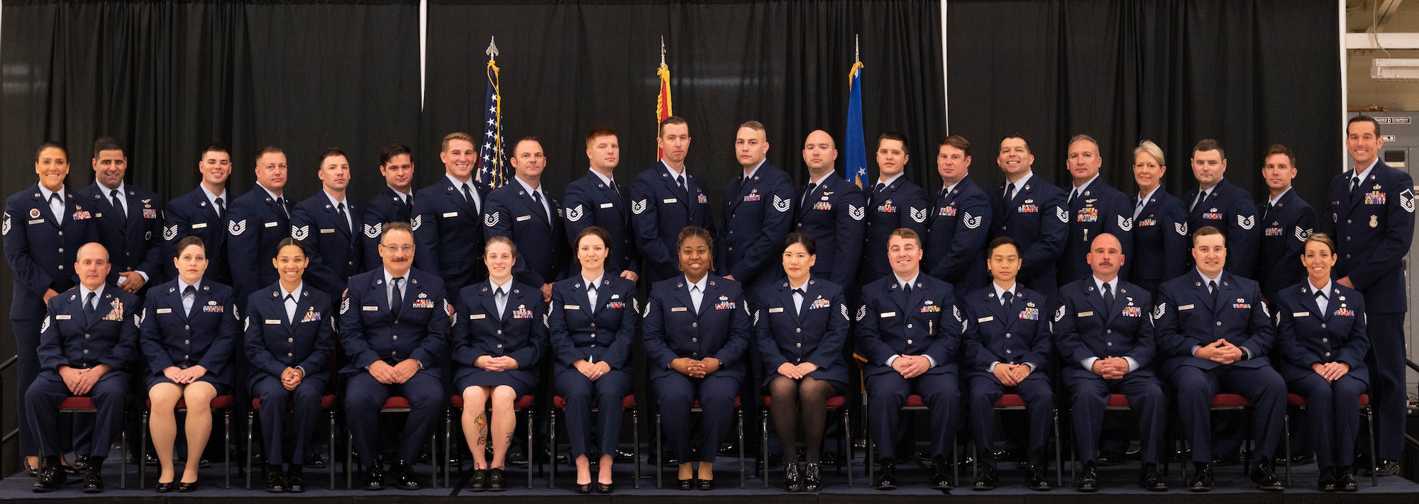 Instructors and class participants pose for a group photo