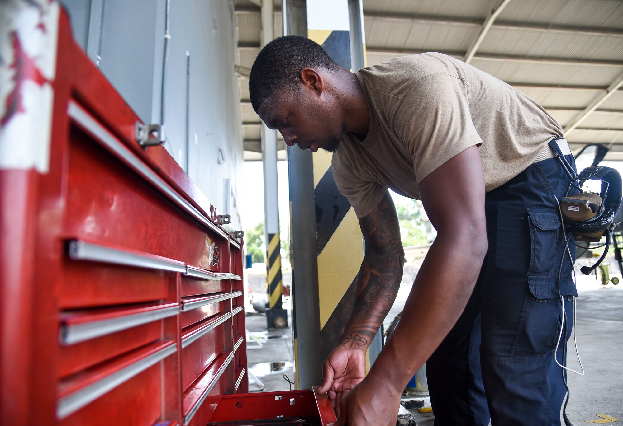 A man looks into a tool shed