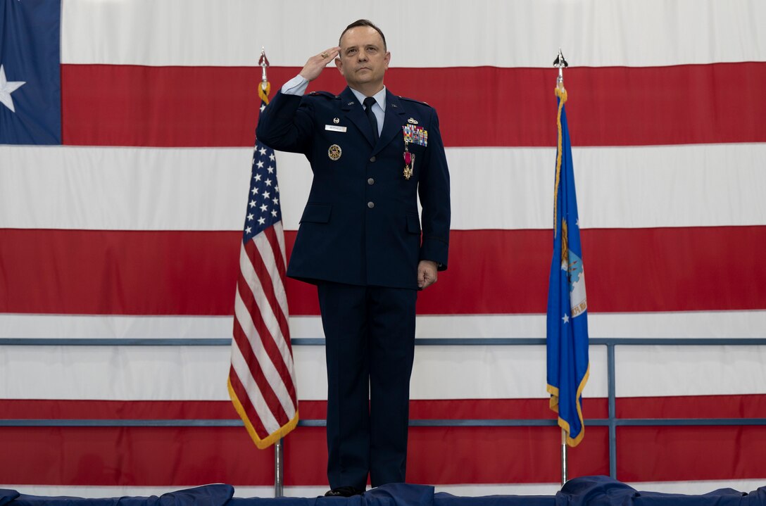 U.S. Air Force Col. Nathan Mitchell, outgoing 28th Maintenance Group commander, renders his last salute as commander during a change of command ceremony at Ellsworth Air Force Base, South Dakota, June 29, 2023.