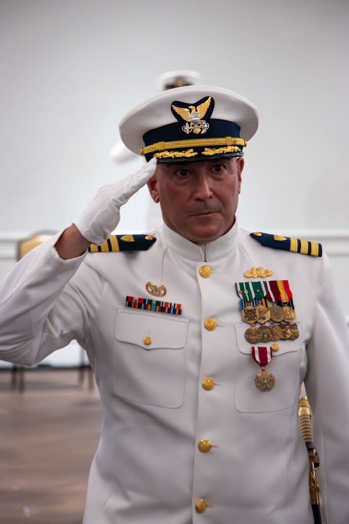 Cmdr. James Lovenstein departs Port Security Unit 305’s change of ceremony after being relieved as the commanding officer during the ceremony held in Newport News, Virginia, June 27, 2023. Lovenstein will become the Senior Reserve Officer of Sector Northern New England. U.S. Coast Guard courtesy photo.