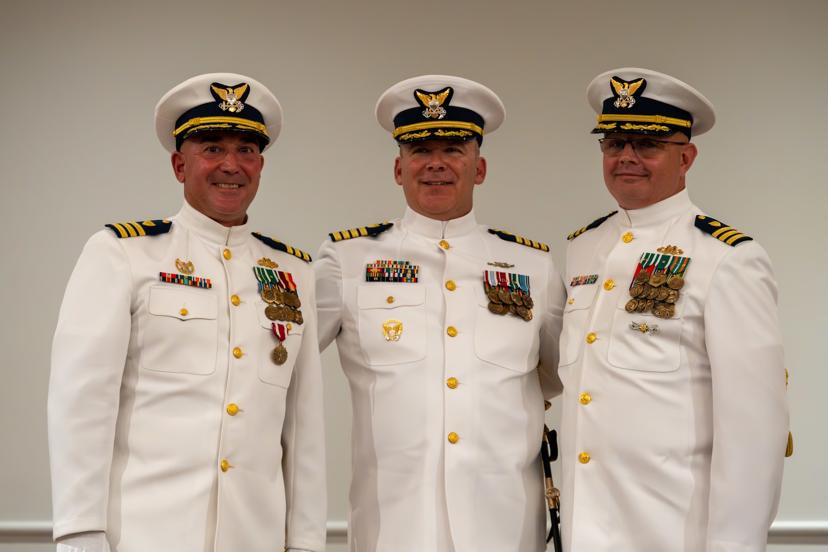 Cmdr. Lovenstein( left), Capt. Ryan and Cmdr. John Elkins pose for a photo following Port Security 305’s change of command ceremony in Newport News, Virginia, June 27, 2023. Cmdr. Elkins relieved Cmdr. Lovenstein as the commanding officer of PSU 305, Capt. Jason Ryan, chief of Pacific Area operations, presided over the ceremony. U.S. Coast Guard courtesy photo.