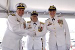 Capt. Kenneth Boda (left) shakes hands with Capt. Michele Schallip (right) concluding a change of command ceremony aboard Coast Guard Cutter Healy (WAGB 20), June 29, 2023, at Base Seattle. Adm. Linda Fagan, commandant of the U.S. Coast Guard, presided over the ceremony which was held to officially pass the duties and responsibilities of the Commanding Officer of Healy from Boda to Schallip. (U.S. Coast Guard photo by Petty Officer 2nd Class Michael Clark)