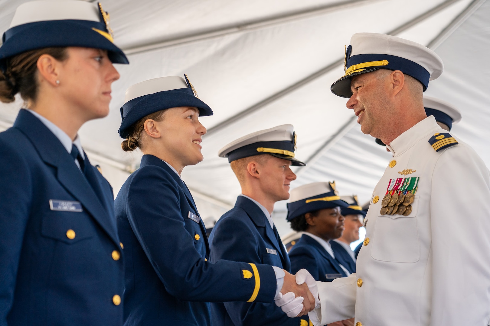 Cmdr. Lee Crusius, the commanding officer of Coast Guard Cutter Alert (WMEC 630) and Cmdr. Matthew Kolodica conduct a personnel inspection during Alert's change of command ceremony in Astoria, Oregon, June 29, 2023. During the ceremony, Crusius relieved Kolodica as the cutter’s commanding officer. (U.S. Coast Guard photo by Petty Officer 1st Class Travis Magee)