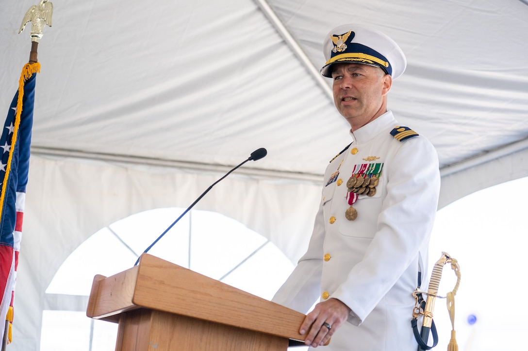 Cmdr. Matthew Kolodica speaks during the Coast Guard Cutter Alert's (WMEC 630) change of command ceremony in Astoria, Oregon, June 29, 2023. During the ceremony, Cmdr. Lee Crusius relieved Kolodica as the cutter’s commanding officer. (U.S. Coast Guard photo by Petty Officer 1st Class Travis Magee)