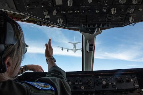 pilot pointing at an aircraft