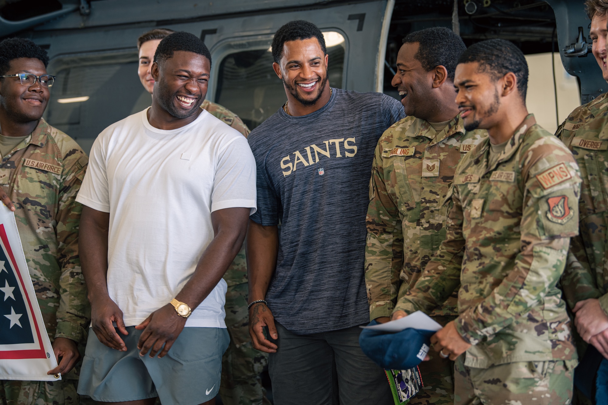 Several individuals posed for a photo and laughing.