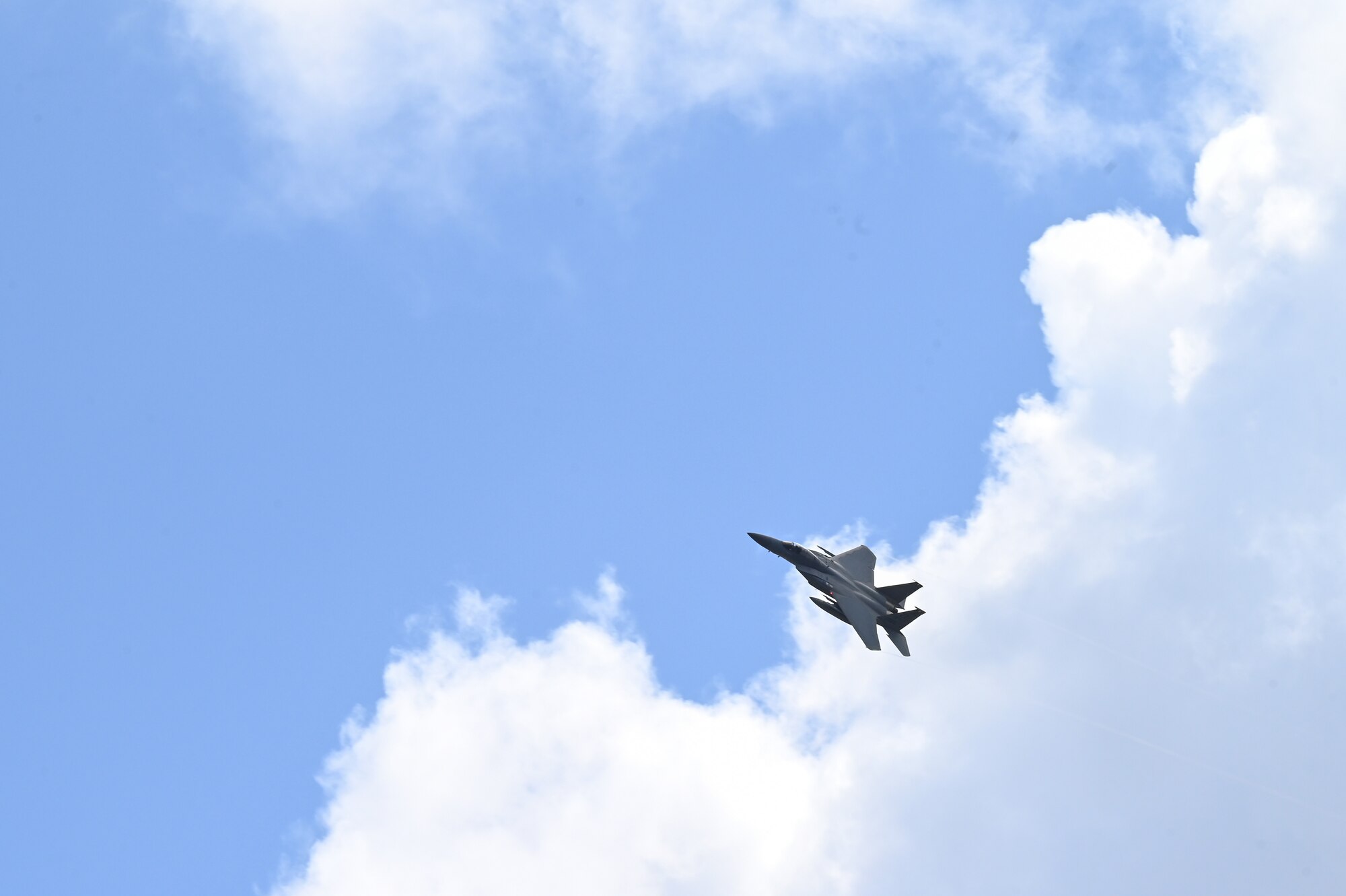 An aircraft flies overhead.