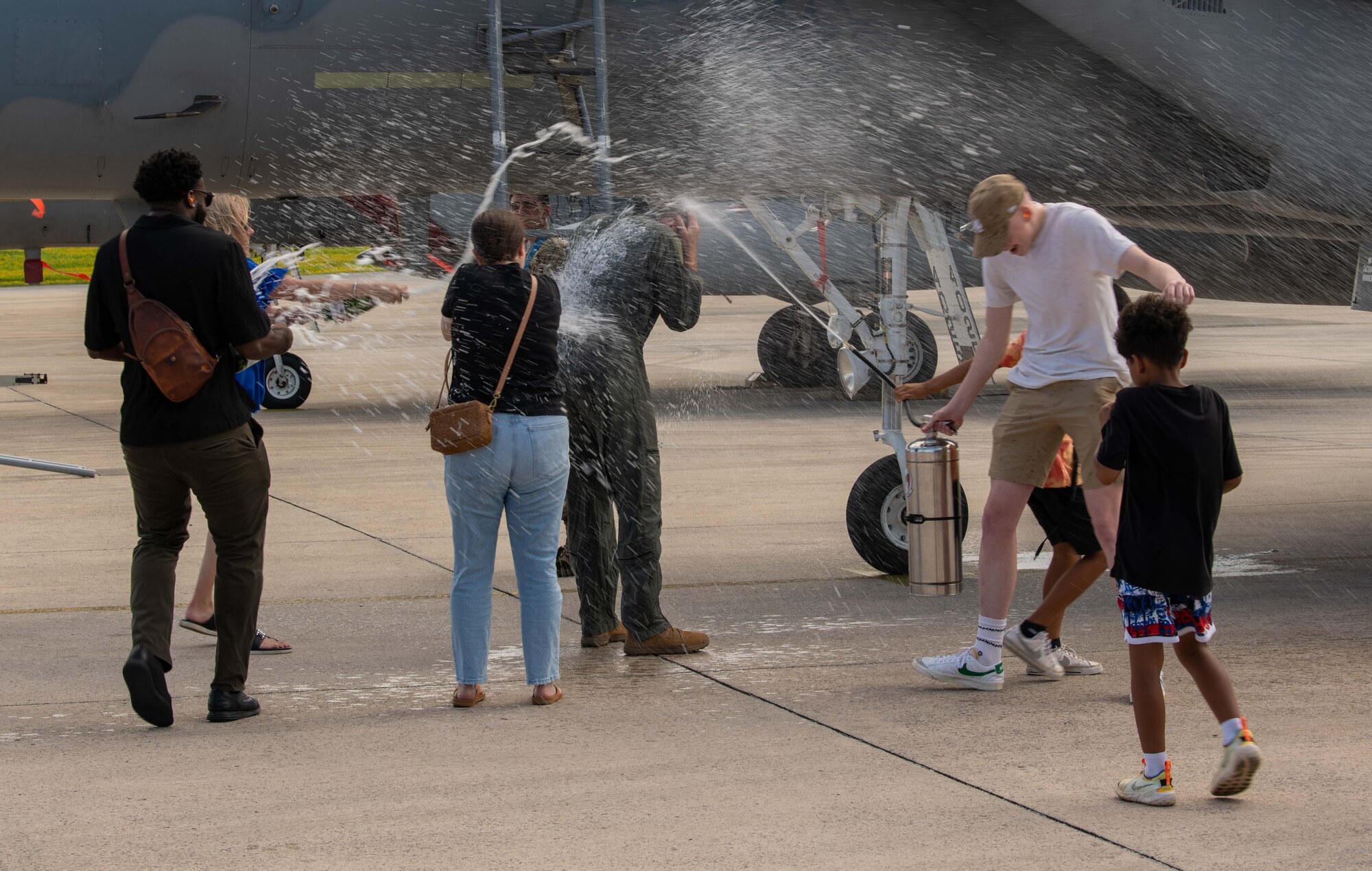 Family and friends celebrate the completion of a fini flight.