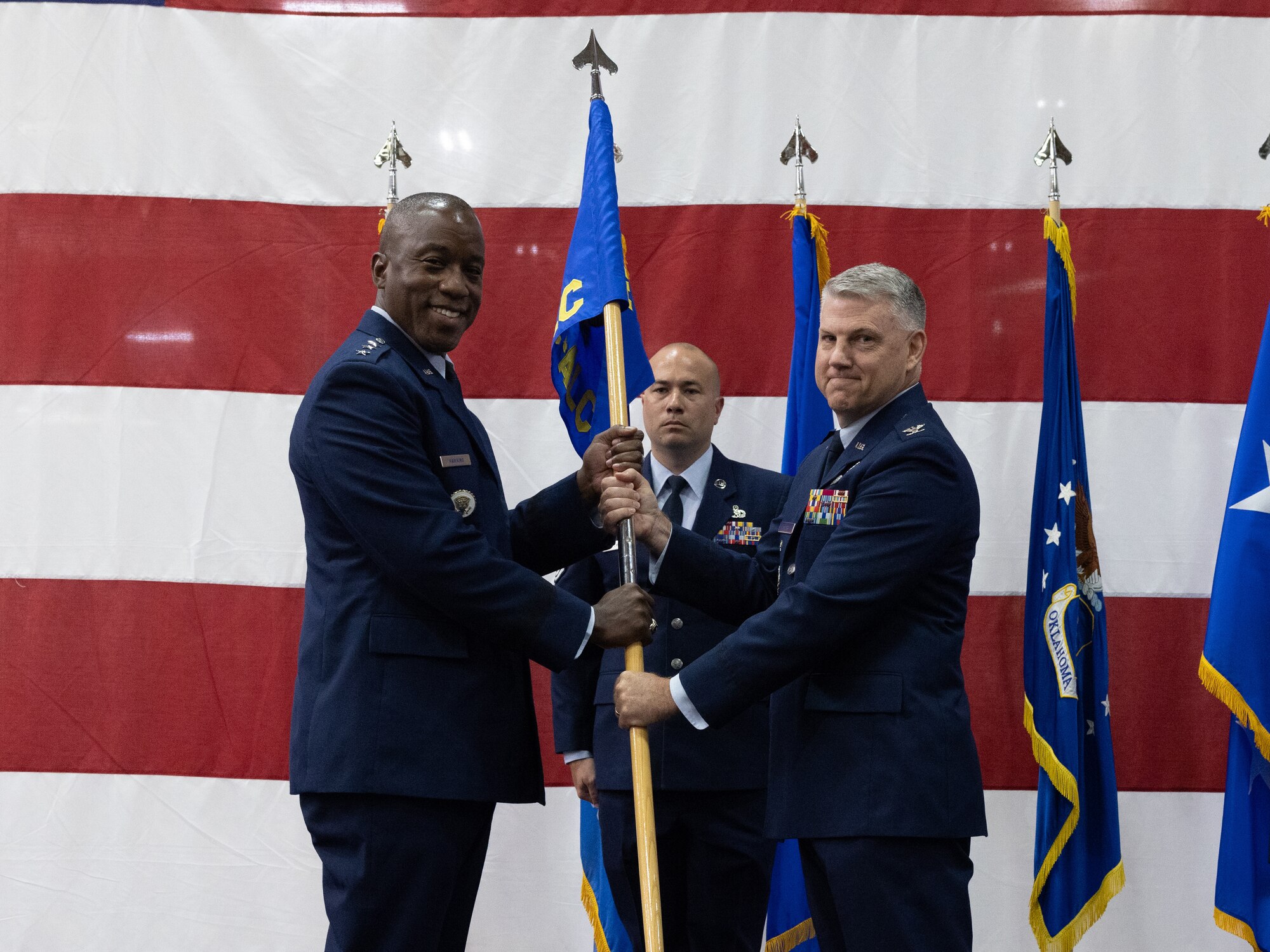 Two men holding flag