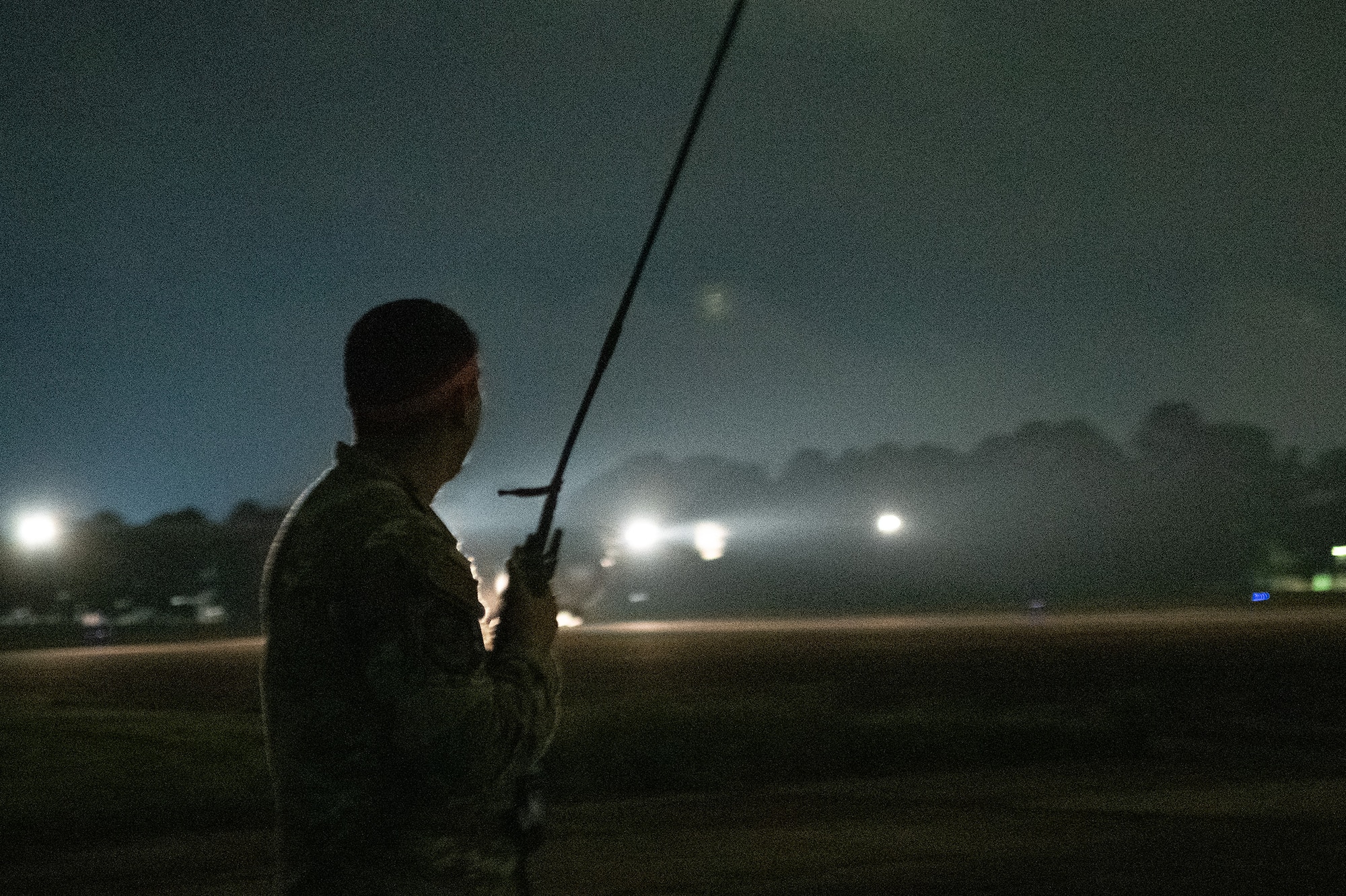 Senior Airman Angel Ramirez, 42nd Operations Support Squadron Radar, Airfield & Weather Systems, watches as a C-130J lands during a “proof of concept” Assault Zone exercise, a first of a kind for the Air Education and Training Command, May 23, 2023.