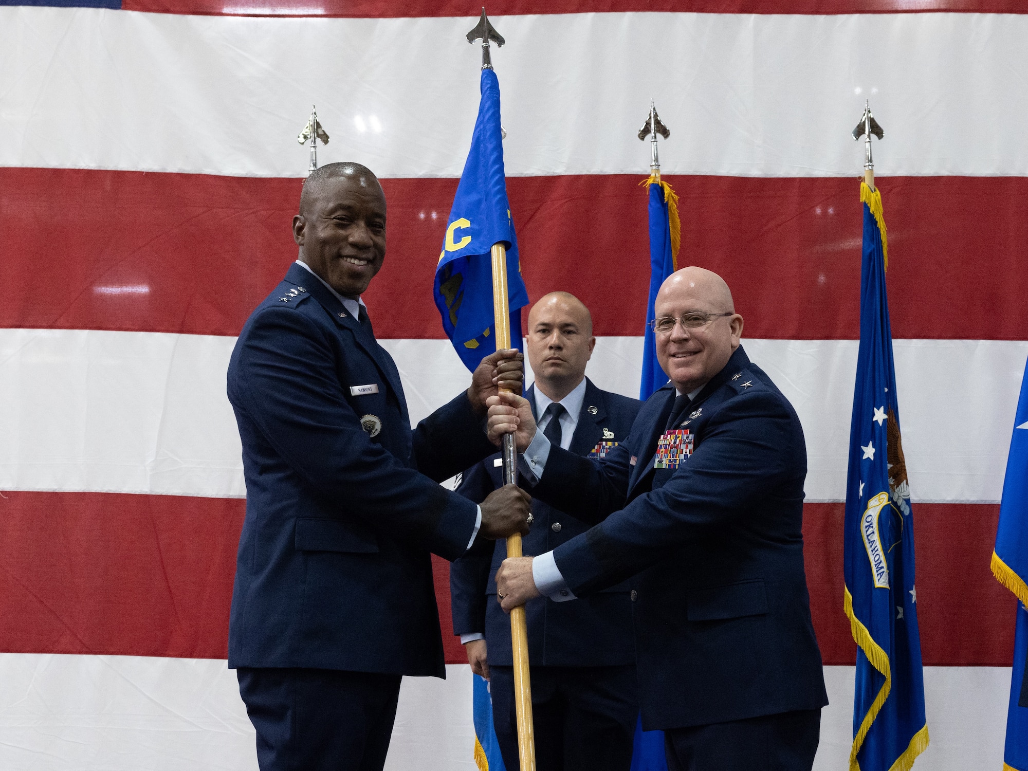 Two men holding flag