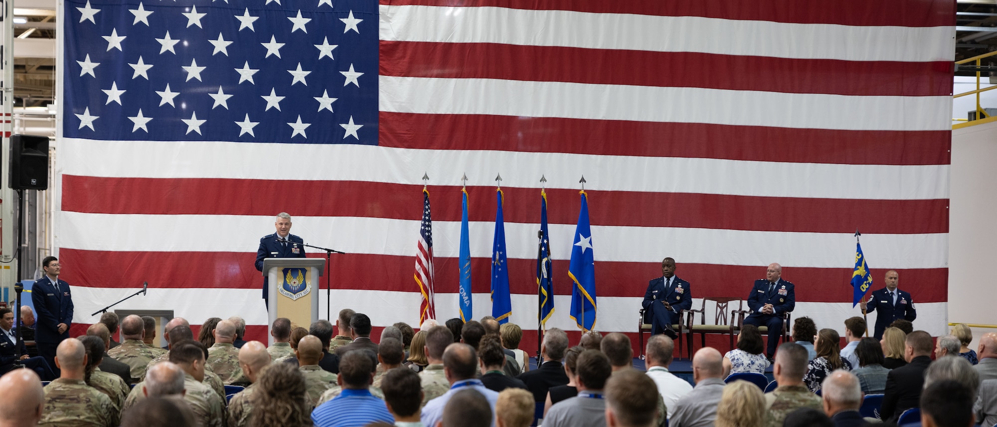 Man speaking in front of crowd