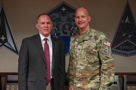  From the left, Dr. Brian Kehl, Space Operations Command Deputy to the Commanding General – Support, congratulates U.S. Space Force Col. David Hanson, commander of Space Base Delta 1, for winning the 2023 Commander in Chief’s Annual Award for Installation Excellence at Peterson Space Force Base, Colorado on June 28, 2023.  Peterson SFB was one of the six recipients of a highly competitive presidential award, selected for their exemplary support of Department of Defense missions. (U.S. Space Force Photo by Airman 1st Class Cody Friend)