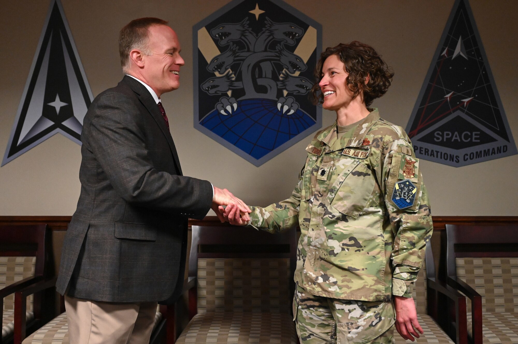 From the left, Dr. Brian Kehl, Space Operations Command Deputy to the Commanding General – Support, coins U.S. Air Force Lt. Col. Erica Tortella, commander of the 21st Civil Engineer Squadron, for her support in achieving the 2023 Commander in Chief’s Annual Award for Installation Excellence for Space Base Delta 1 at Peterson Space Force Base, Colorado on June 28, 2023. The coin reads, “presented by the deputy for support for superior performance, 071 Space Operations Command.” (U.S. Space Force Photo by Airman 1st Class Cody Friend)